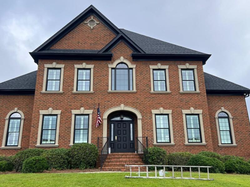 Modern exterior color palette on a brick home in Lexington SC- professionally painted trim, door, soffits