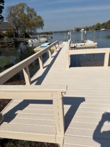 After view of the Lake Murray dock restoration. The weathered wood has been replaced with warm, gray stain.